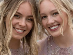 Close up of Two bridesmaids smiling at camera