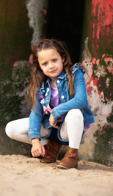 Young girl in denim shorts and jacket